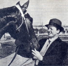 Sergey Yakovlevich Lemeshev at the Moscow Hippodrome, about the stallion of Berendey, who won the S.Ya. Lemesheva. 1940. Photography. (     ,   ,    .. . 1940 . .) (Belyaev)